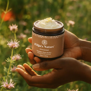 Golden Beauty Butter - #scent_Unscented  #size_16oz - Hands holding an Unscented jar of Elija’s Nature Golden Shea Butter in a field of wildflowers